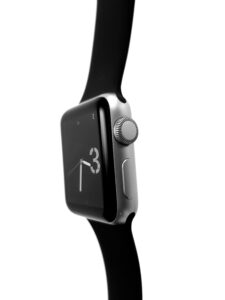Black smartwatch with a black strap on a white background